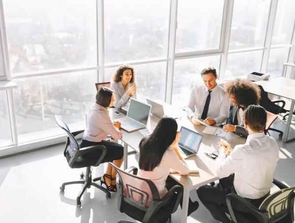 group-work-by-glass-window-in-office