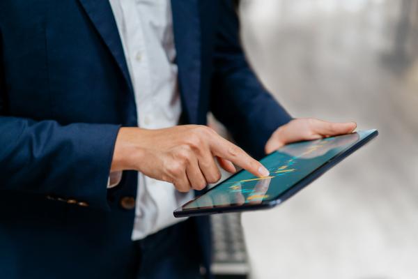 man holding a tablet