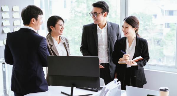 group of Asian people in a meeting