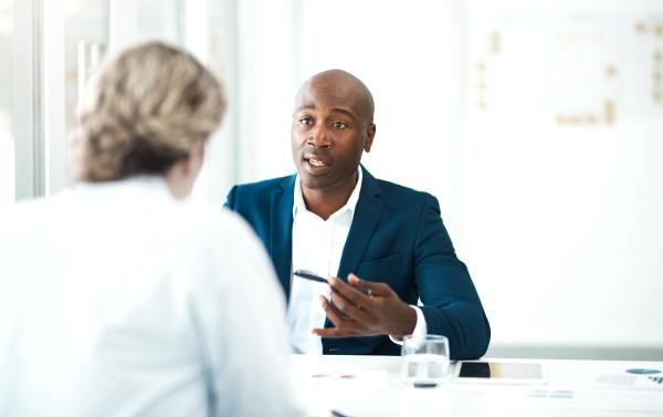 man interviewing a woman