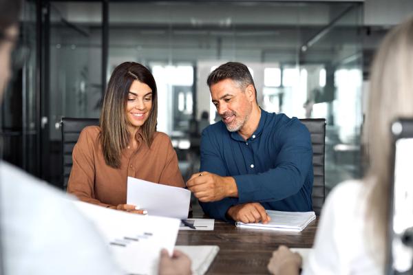 two people working with documents