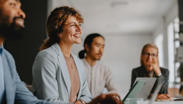 woman smiling in a meeting