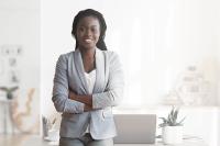 confident business woman in grey suit