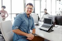 man smiling while working