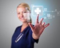 a nurse pointing to a screen