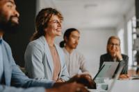 woman smiling in a meeting